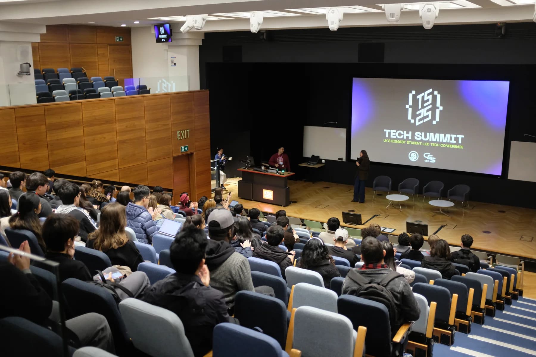 A large audience watches a speaker on stage at KCL Tech Summit 2025.